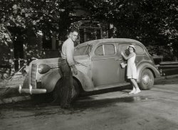 Taken in New Jersey about 1939, my Dad and my sister waxing Dad's pride and joy, a 1938 Dodge sedan. View full size.
&quot;Waxing&quot; nostalgic?I really like all the details in this shot.
Great photo!
Train &#039;em young!Upon closer examination, I noticed a hose in Dad's hand, so I guess they were washing rather than waxing. In any case, it does pay to train 'em young!
But it&#039;s a &#039;38I know 'cause I had a '38 in high school in 1952.   The '38 grill was rounded on the sides.  Floating Power!
(ShorpyBlog, Member Gallery, Cars, Trucks, Buses)