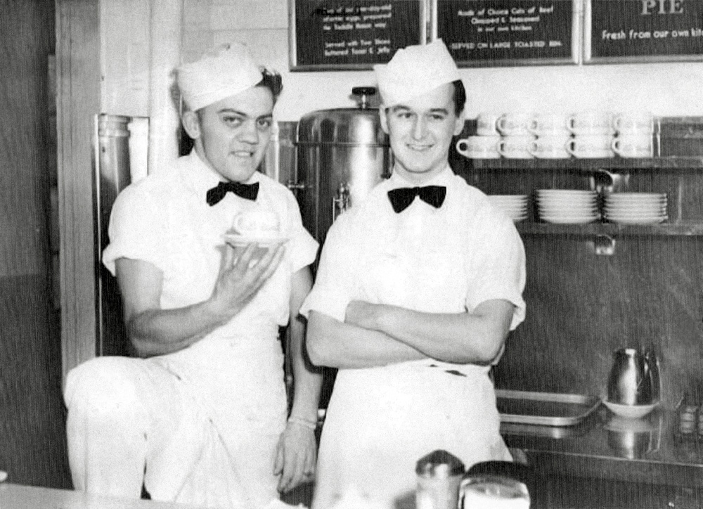 My dad, Joe Iwansky and his buddy Ed Moose (holding the coffee cup) in Newark, New Jersey in 1951 at the Toddle House Quick Serve Restaurant. Dad worked part time waiting to get his dream job at DuPont. View full size.