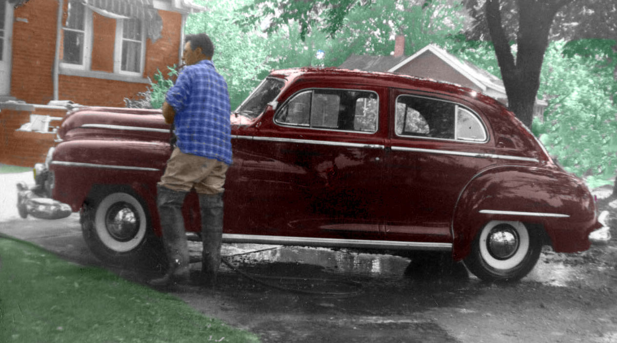 My dad's 1946 Dodge Custom Town Sedan. Notice that the rear doors are hinged on the center post and not "suicide" doors. The Town sedan was the only Dodge with this feature. We thought this was the fanciest car we ever had. Two-tone maroon and gray velour upholstery and a speedometer that changed colors according to your speed. 50 mph and above was red. Taken in Melvindale, Michigan, in 1948. View full size.