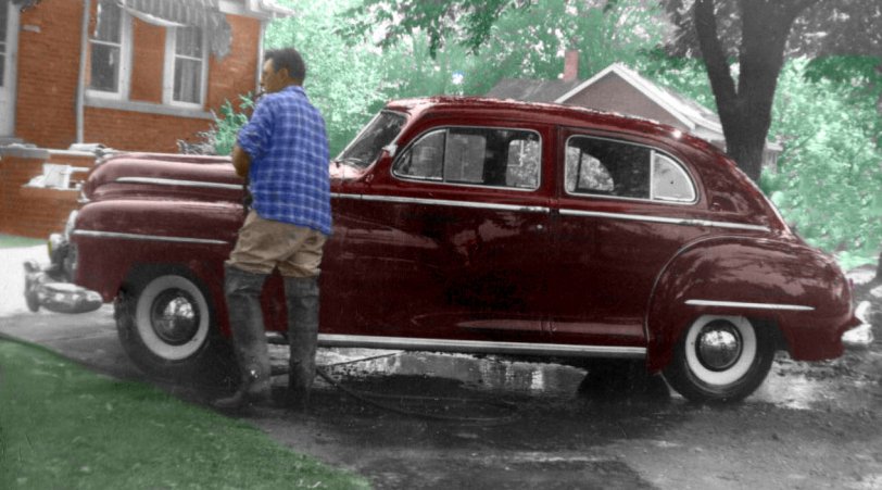 My dad's 1946 Dodge Custom Town Sedan. Notice that the rear doors are hinged on the center post and not "suicide" doors. The Town sedan was the only Dodge with this feature. We thought this was the fanciest car we ever had. Two-tone maroon and gray velour upholstery and a speedometer that changed colors according to your speed. 50 mph and above was red. Taken in Melvindale, Michigan, in 1948. View full size.
