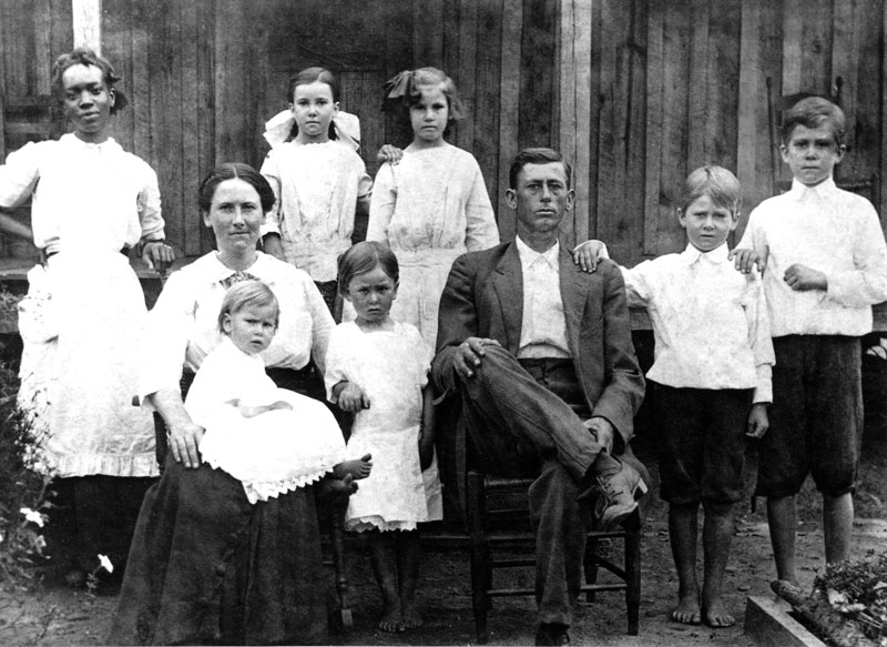 Father with family about 1910. View full size.