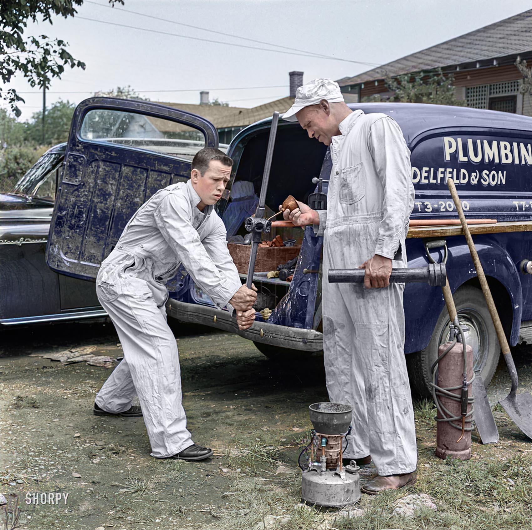 Paul helping father at plumbing business.

Colorized version of this Shorpy old photo.
View full size.

