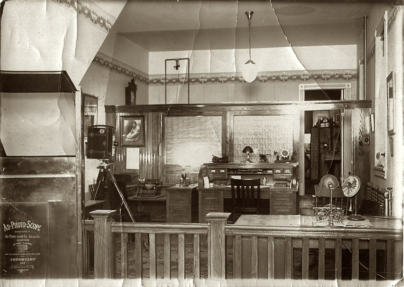 Photo studio, year unknown. Writing on the equipment at left says, among other things, "Use Alternating Current."