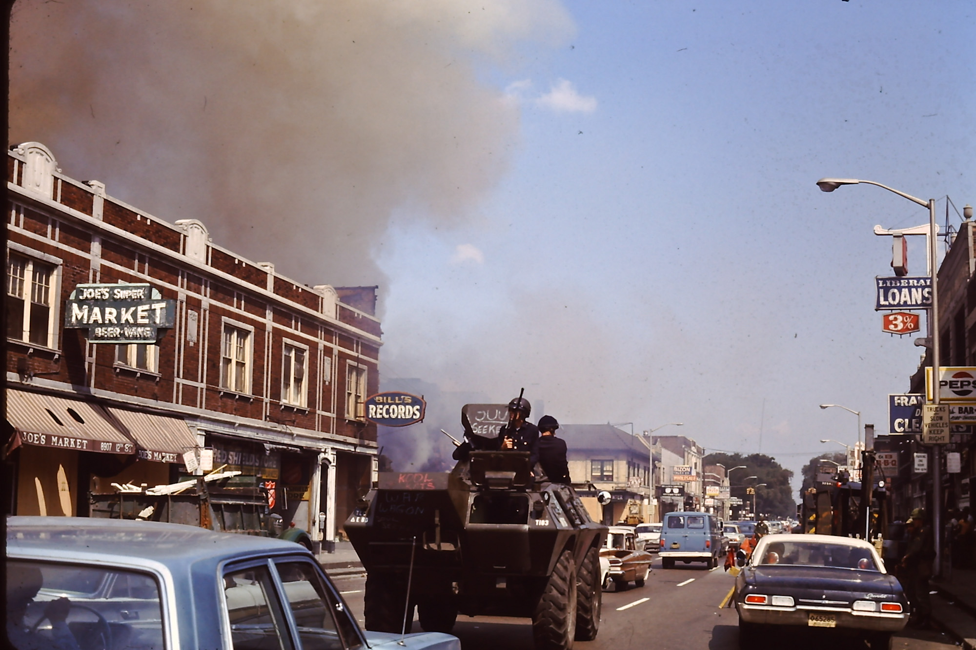 This is one of about 100 slides that my Grandfather took in downtown Detroit during the riots in 1967.  Police friends took him on a tour of the area in a police car. View full size.