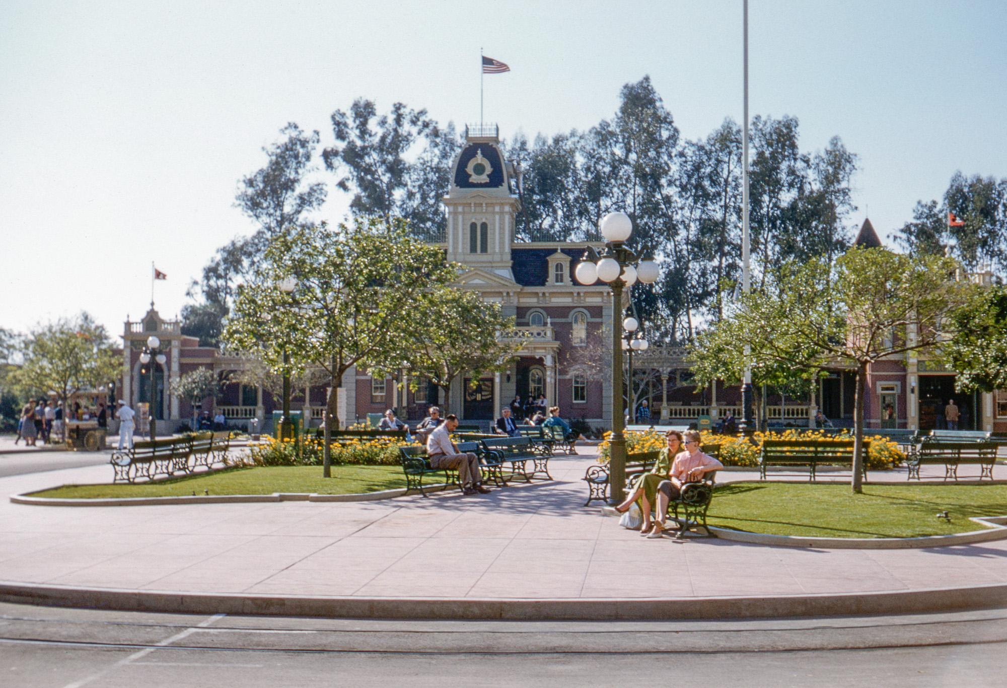 This tranquil scene, much less the sight of people in suits, ties, earrings and heels, may have today's frazzled visitors questioning if this is actually the Magic Kingdom. Nevertheless, my brother-in-law took this Kodachrome slide there in February 1958. View full size.