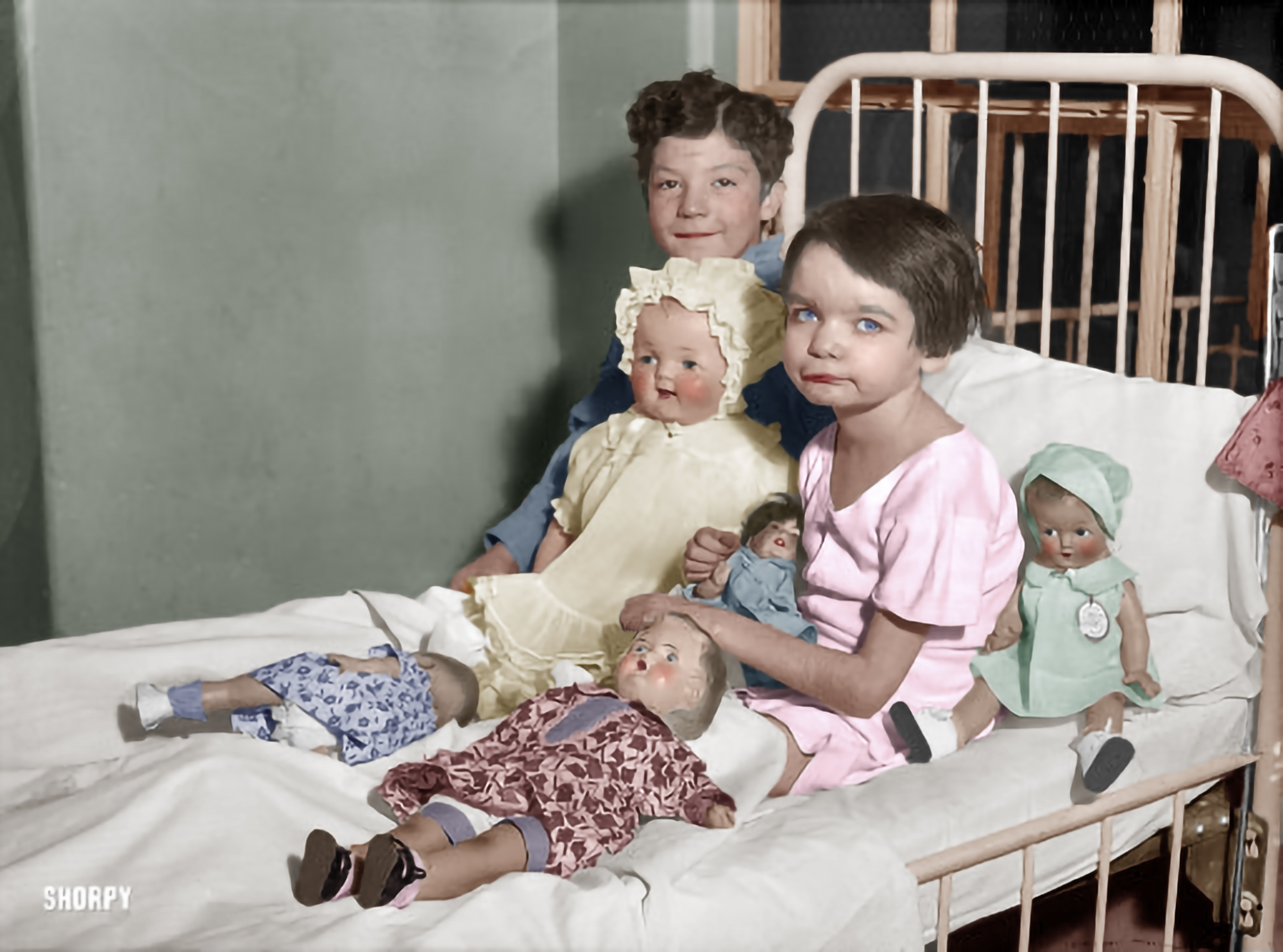 Colorized version of this image showing "children in hospital bed with dolls." Washington, D.C., 1931. Harris & Ewing glass negative. 

This is what children did before computers, cell phones and social media. We may have made great gains in technology, but in my opinion, we lost a lot.
