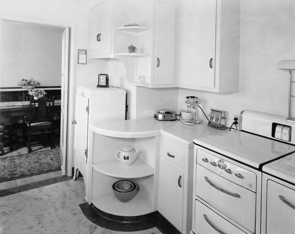One view of the kitchen at my grandparents' house, 4645 Hazelbrook Avenue in Long Beach (now Lakewood), California, ca. 1939. 8x10" B&W print, on the back of which is stamped:

E. A. WILLIAMS
PHOTOGRAPHER
ANGELUS 14750 - L. A.

I would have guessed the picture was taken in the mid-1940's to early 50's, but the photographer - my great-grandfather Everett A. Williams - was killed in a car accident in 1940. View full size.