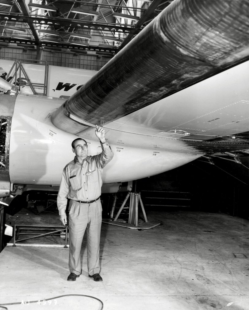 My grandfather, Warren Erickson, a Trans World Airlines mechanic and inspector. He's in Burbank, California as a quality assurance guy stationed at Lockheed's plant as TWA accepted the Constellation into their fleet. This picture, taken in 1958 or 1959, is from a promotional set showing Warren inspecting part of the wing. My Mother told me that TWA commissioned these shots taken as a way of showing their top guy was on the job.
The Constellation was a Clarence "Kelly" Johnson design. It was a cutting edge airplane. Nothing was sleeker than the Connie. The Connie had a lot of growing pains, as did other piston engine airliners of that era. By the time Lockheed and TWA worked out the problems in the late '50s the aircraft was obsolete.
I have posted a couple other photos of Warren here and here.
Thanks, and enjoy. View full size.
