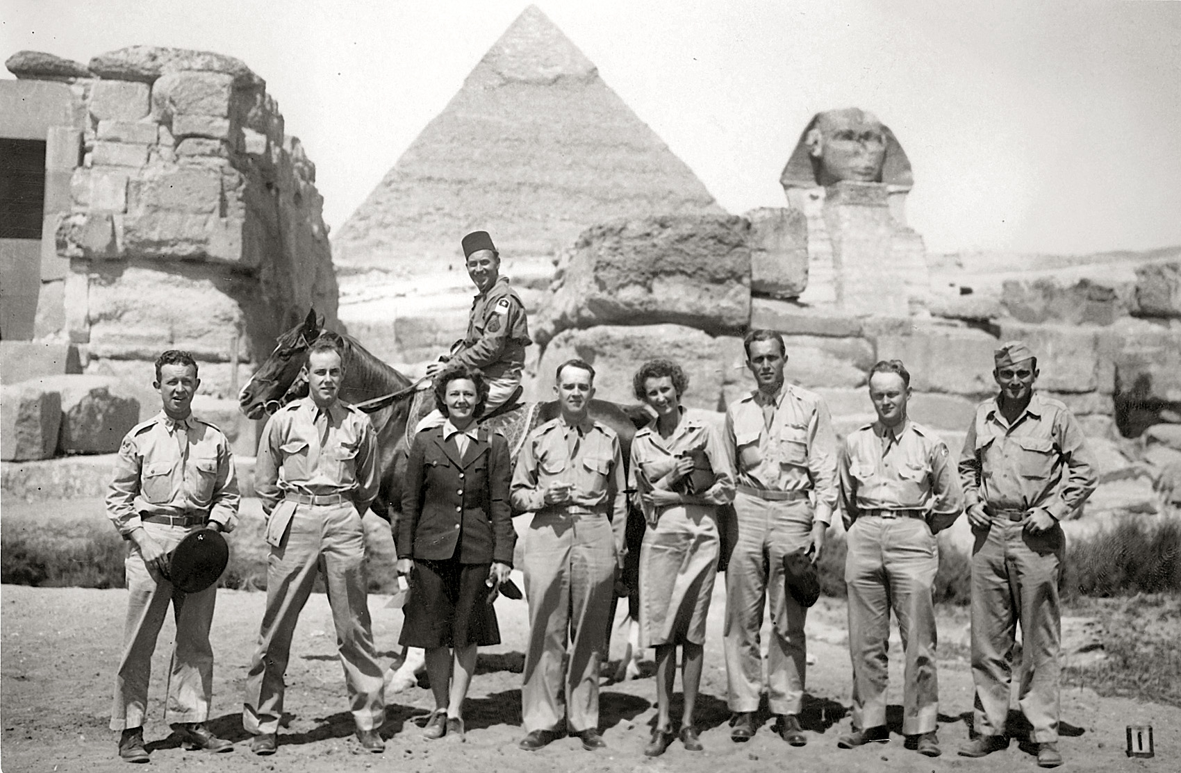 Here's my grandfather again, at the Pyramids in Egypt in 1944 or 45. He's the tallest guy, just to the right of center. I don't know who the other people are or what's going on, sadly. View full size.