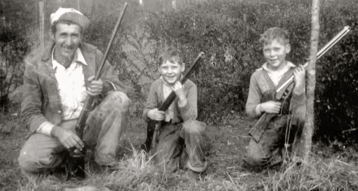 My grandfather and his two boys--very proud.  The only consistent type of photo from Dad's youth is "with new guns."  The boys were taught how to use these safely to get dinner.