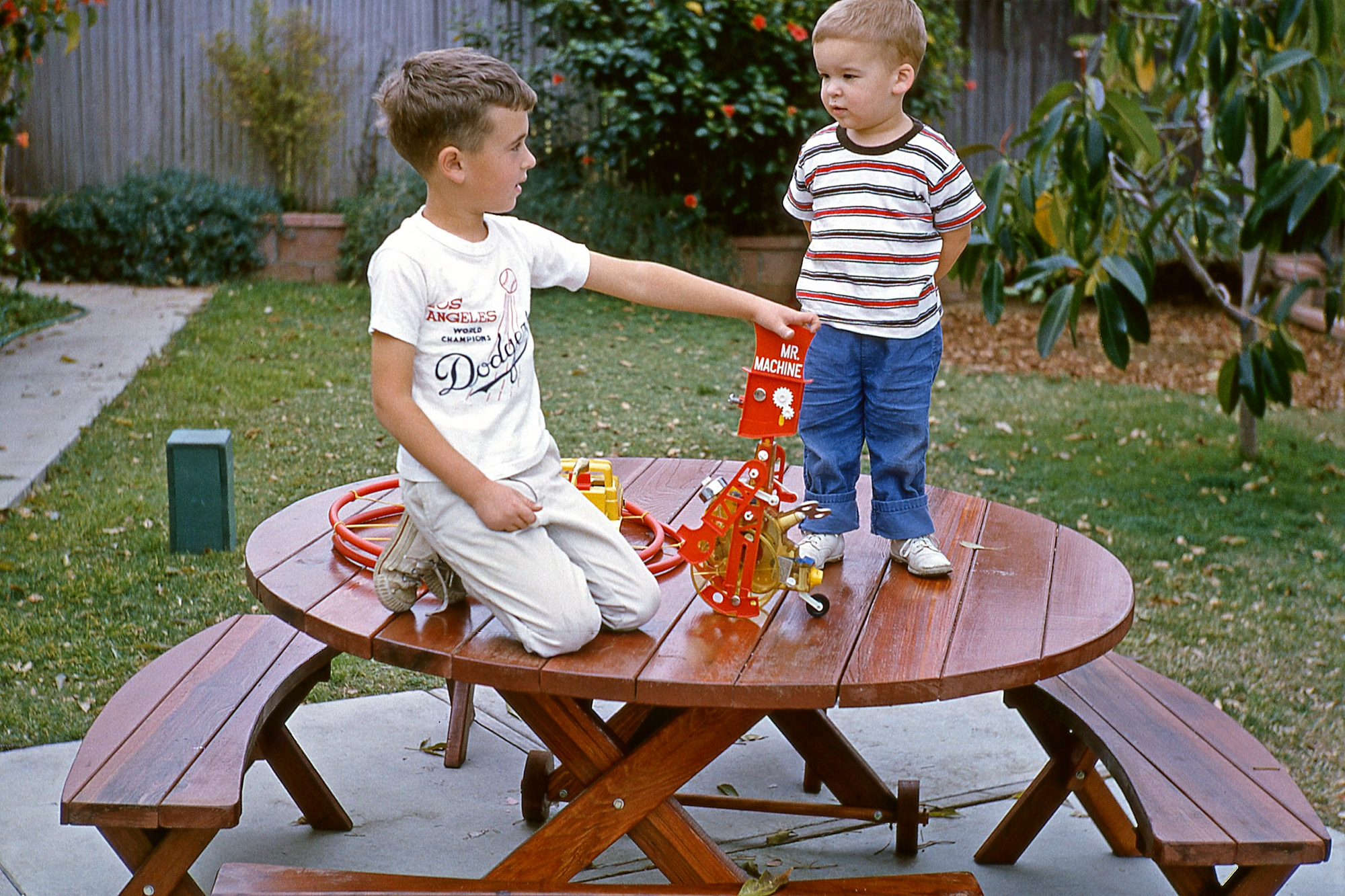 February 1965. My little brother with me and Mr. Machine, in a Kodachrome taken by Dad a few days after my birthday in La Habra, California. Not only is this slide still in good shape, so is Mr. Machine, and my brother, too. View full size.
