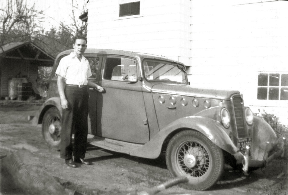 My dad, Carl Bangs Jr. with... a car. Someone else can tell me what kind! Probably taken in the early 1940's, I'm guessing it was his first car. View full size.