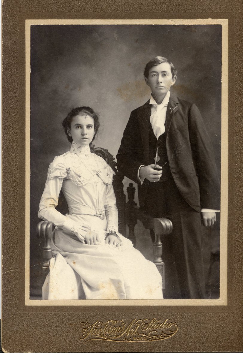Mr &amp; Mrs James Granville Stovall (nee Loretta Roan Wayland), who were married at Christmas time, 1899.  They lived in Limestone County, Texas but went to Waco, to Jackson Studio, to record their newly married state and some obvious prosperity. This is another portrait taken at the same time as the more traditional pose of the gentleman seated and the lady standing.  They are my maternal grandparents. 

