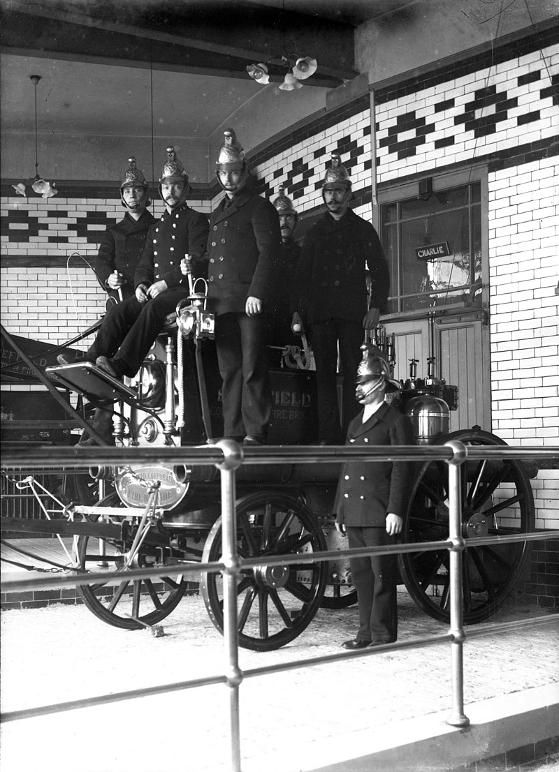 Taken at a fire house in Sheffield, England, 1902. The horse in charge of this watch was 'Charlie,' whose name is above his stable on the top right. Scanned from the original 7x5 glass negative. View full size.