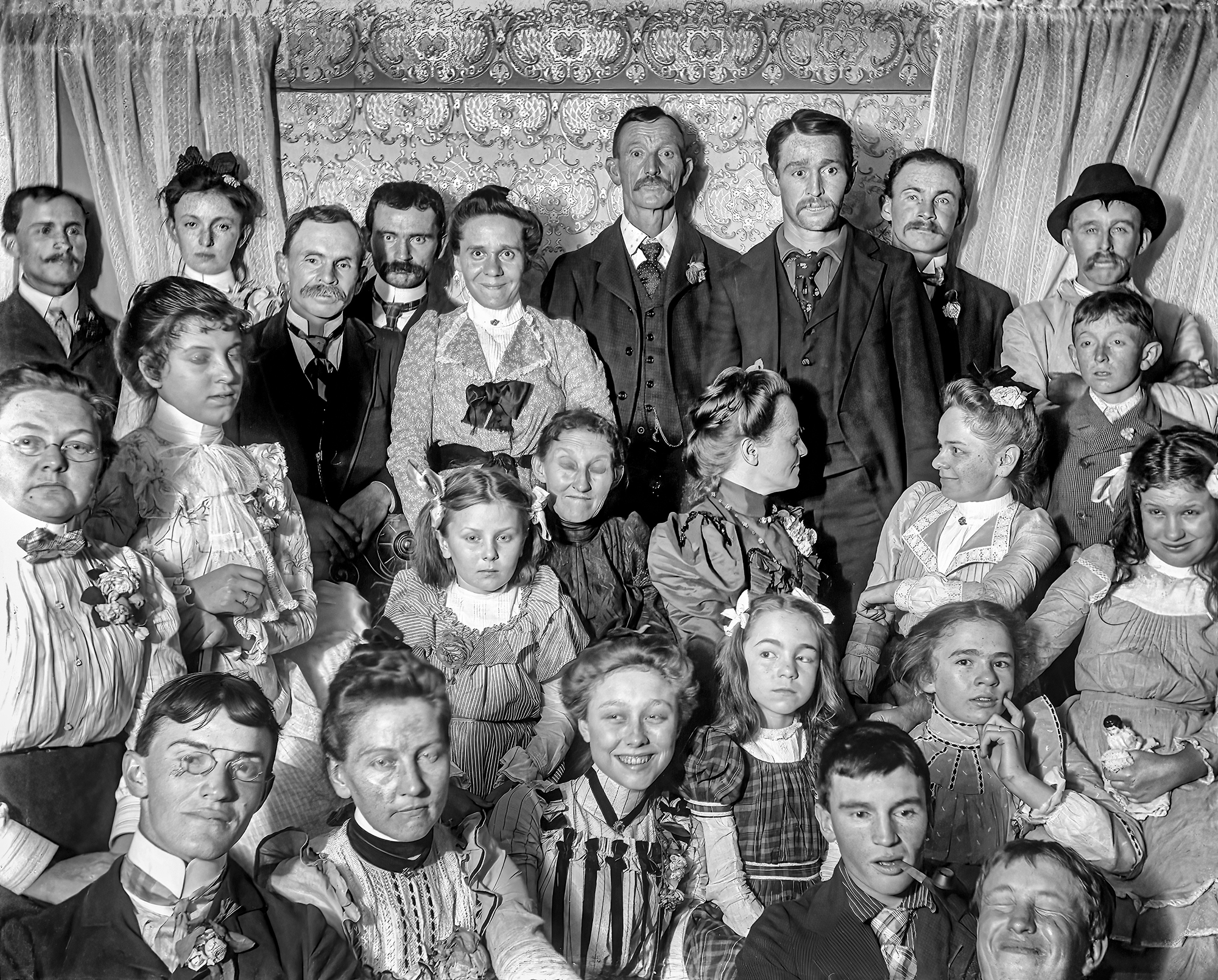 This image was found in a stash of circa 1910 glass negatives from Floyd Ingraham, who lived in Springwater, New York. I know nothing about who's here or why they were gathered in someone's parlor, but I love its Norman Rockwell vibe. Every face looks like one of his subjects. Scanned from a 4x5 inch glass plate. View full size.