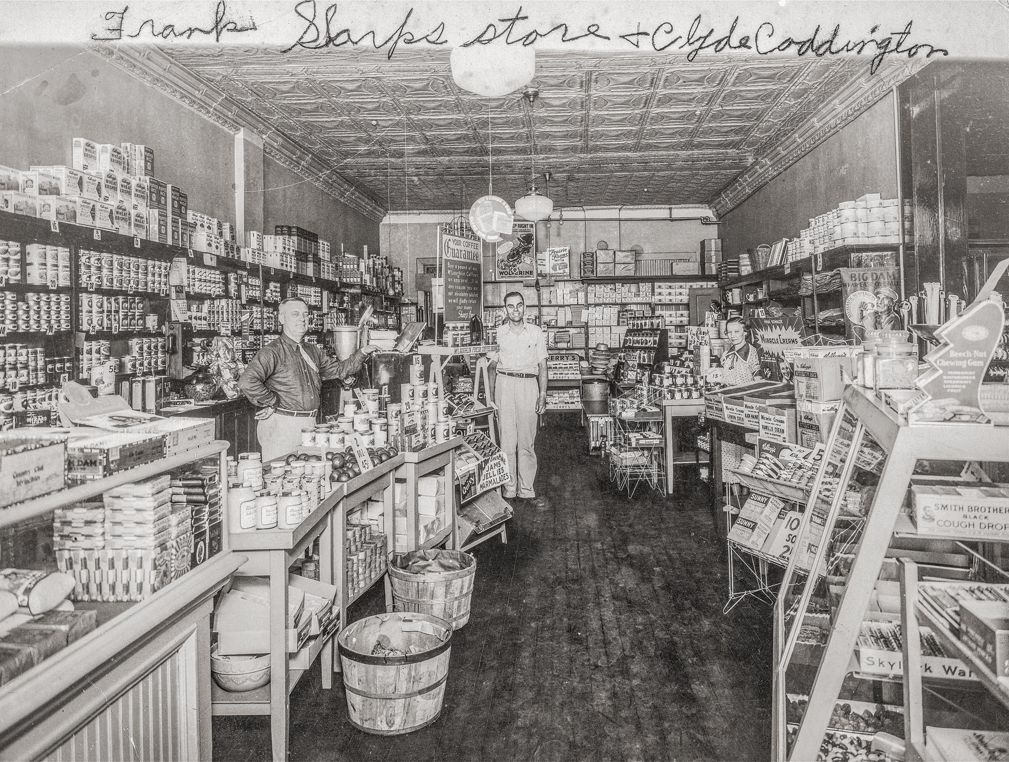 Frank Sharp's store in Tremont, Illinois.  June 1936. Frank is seen with Clyde Coddington and Minnie Broner. The store operated from 1928 to 1965 and was located across the street from Beechams Market, where the present day First National Bank of Tremont is located. 

Property of, and used by permission of, the Tremont Museum and Historical Society, corner of Sampson and Madison Streets, Tremont, IL.