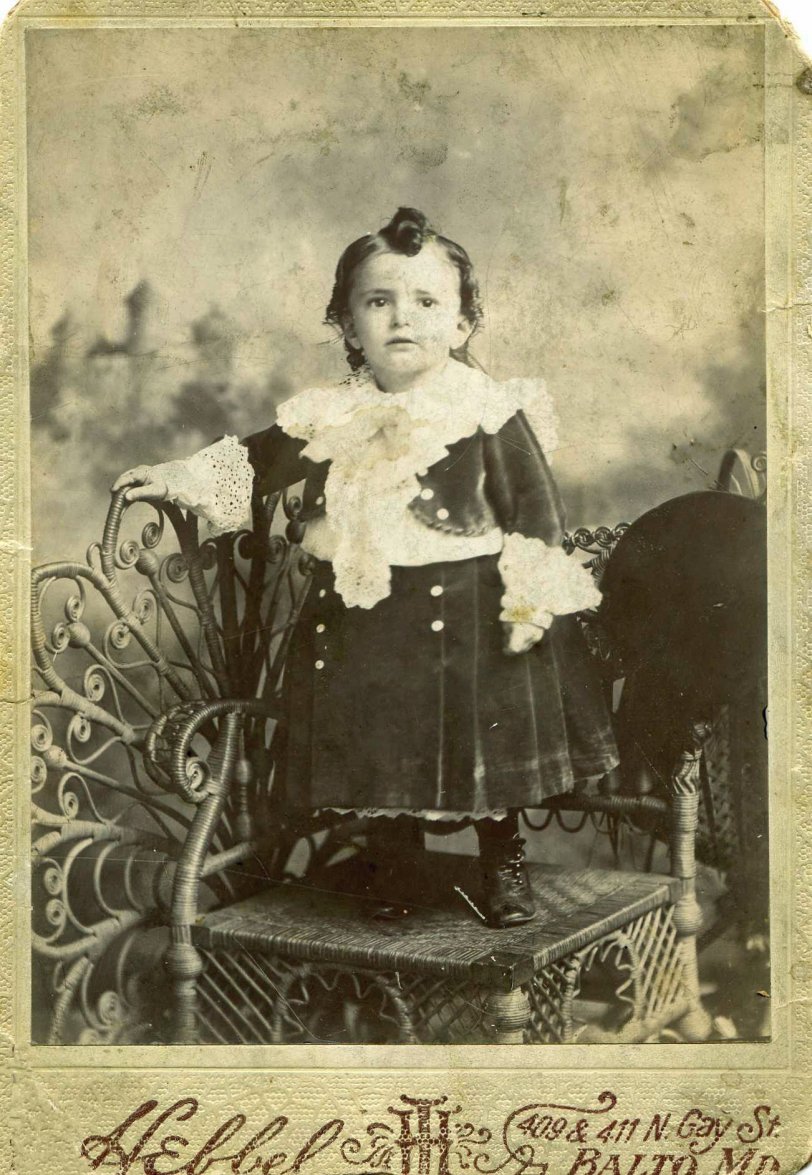My father circa 1901 taken at a photography studio in Baltimore. Yes, baby boys in the Victorian era did wear dresses. Also, the Victorian age lasted in the US well into the Edwardian age in the UK. View full size.
