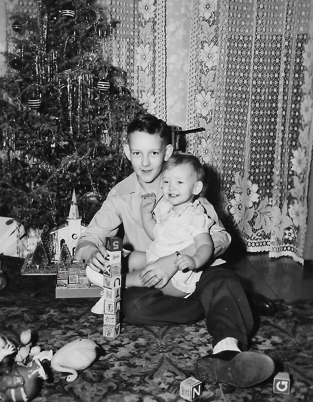 Gayl and Brother Charles, Christmas 1948. After her fun time in front of the camera (still have to find out, but I do know that it was not a Brownie), she and my brother-in-law, Charlie posed. Although I have to say, he was not a good speller then. View full size.