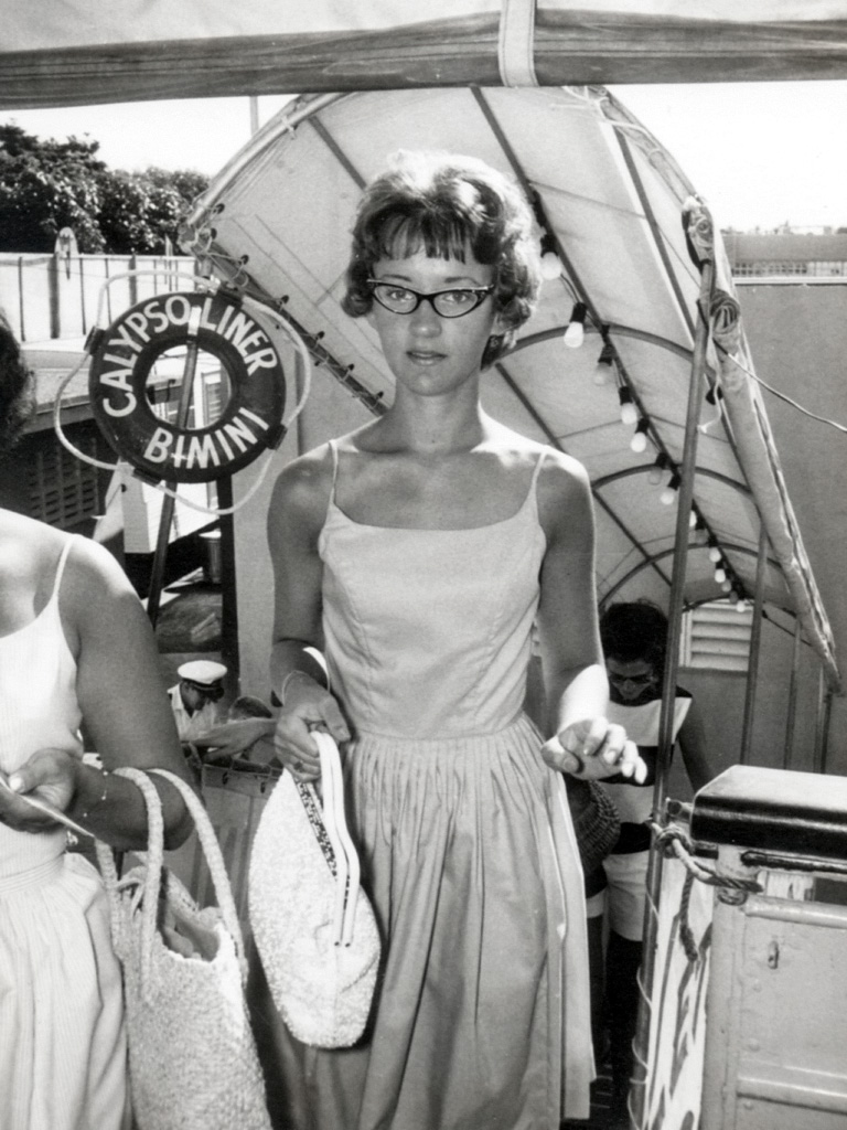 When my wife was a young lass her parents took her on a trip to Bimini and this photo was taken as she climbed up to the top deck. She bought a new purse just for the trip. I believe the year was 1964 or 65, but I could be mistaken. View full size.