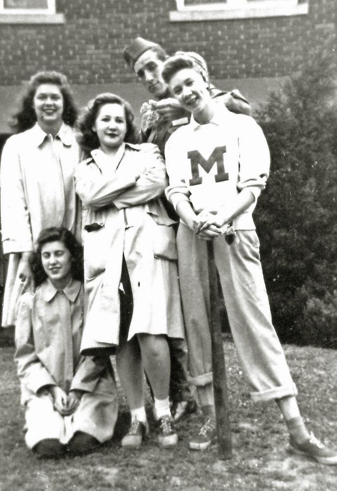 My mom, Virginia Fryxell, in 1942, on the campus of Millikin University, in Decatur, Illinois, with sorority sisters from Alph Chi Omega. She's the one with the M on her chest. She married my dad, Allen Larsen in 1947. I have no idea who the soldier in the picture is.

