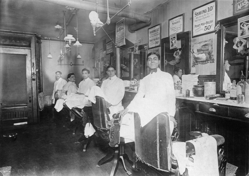This is my grandfather (forefront) at work in the North End of Boston around 1915.  He came to the US from Italy (as a little boy) around the turn of the century and started working in a barbershop sweeping floors. View full size.
