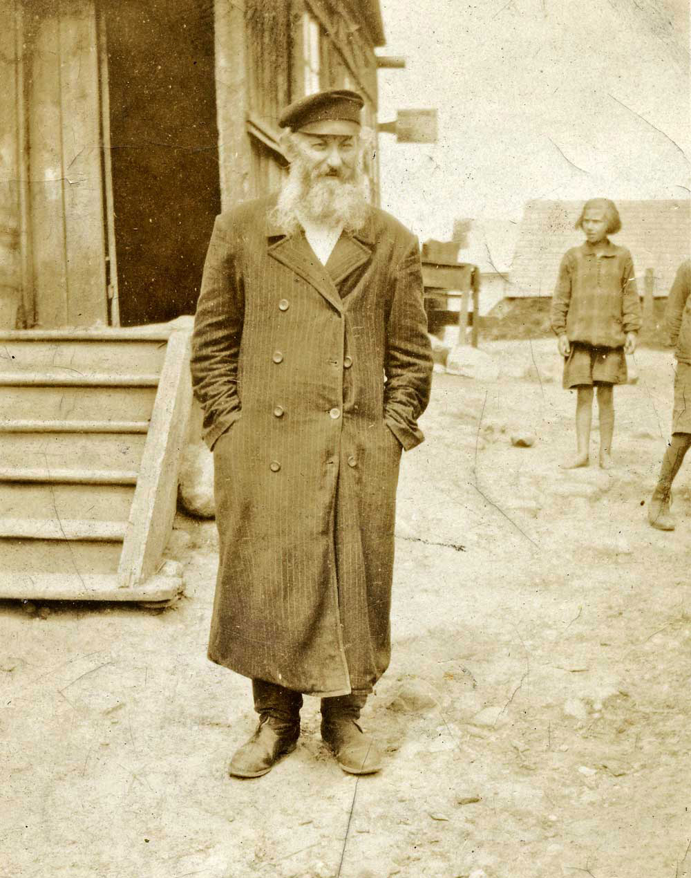 This image was found among a collection of family photos, with the caption "Grandfather Russia 1921."  Possibly taken in Grodno (now called Hrudna), in Belarus. On the back of the photo is written a free-verse poem:


I want so much, yet
   I live so little
Things mean nothing
But God, the wants, the needs
   the hungers
Oft even the shortest life
Are greater than the longest
   death.
Yet we desire, oh Lord, heaven
And receiving earth, are satisfied.

Let me forget fool's advice
And bask in childlike happiness
Yet I am human, and must want
Everything, receiving but percent


I've no idea who wrote the poem.

View full size.