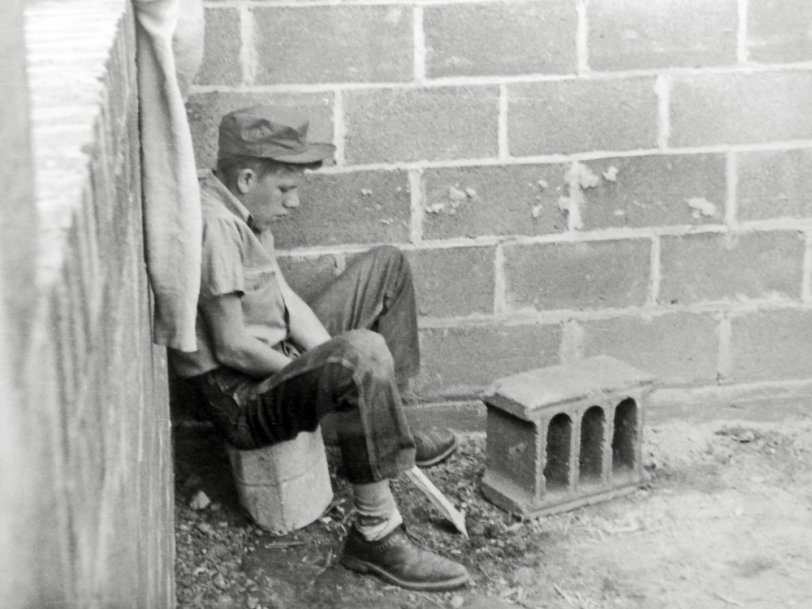 Bethesda, Maryland: 1947.  My grandfather was a skilled brick and stone mason. He insisted upon taking his son out of high school in favor of attending a trade school.  His reasoning was that my father would always have a means by which he could make a decent living.  Pictured is one of his weary young classmates. View full size.
