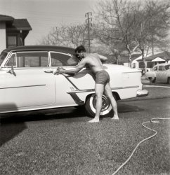 Grandpa washing the Oldsmobile. This was taken during the mid '50s in Los Angeles. Scanned from a medium format safety negative. View full size.