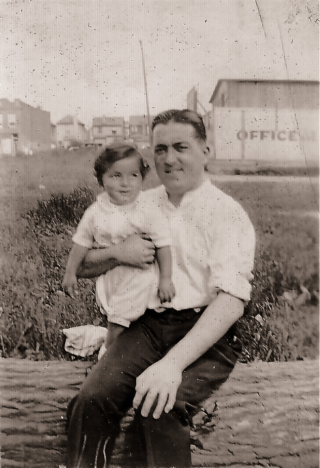 My grandfather and father pose in front of a lot in Brooklyn. Taken around 1930. View full size.
