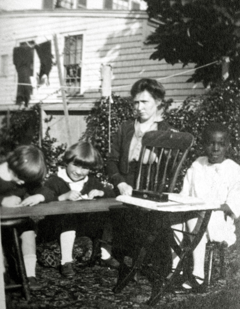 Hartford, Connecticut.  In spite of the heat, the children keep cool in their air conditioned environment. My great-grandmother looks stern enough to put the fear of God into her students. View full size.
