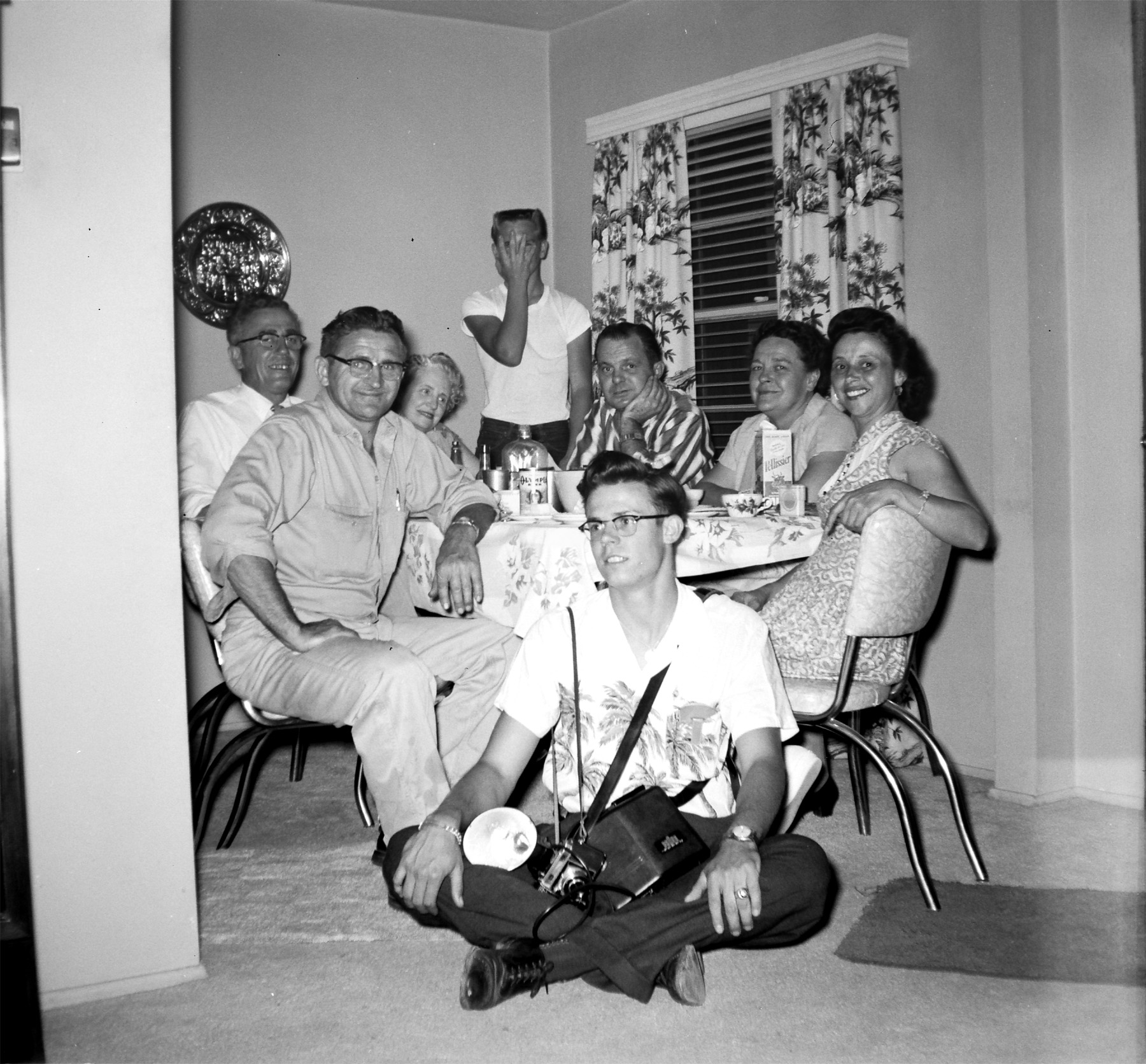 This was taken at my great grandparents house in LA who are seated at the table (second from left and far right) with some neighbors. They were very close with their neighbors, something I think is missing in many suburbs these days (including my own). Can anyone identify the camera? View full size.