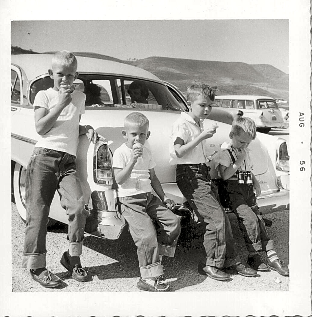 Marineland of the Pacific on the Palos Verdes Peninsula in 1956. Left to right are my two cousins visiting from Texas, myself, and my brother. Inside the 1955 DeSoto are my Granny and my Aunt. We are all enjoying our ice cream at the end of a day of watching the fishes. All but my little brother, that is. His ice cream has rolled out of the cone and can just barely be seen on the ground at his feet on the right. It wasn't the first or the last time that would happen to him. View full size.