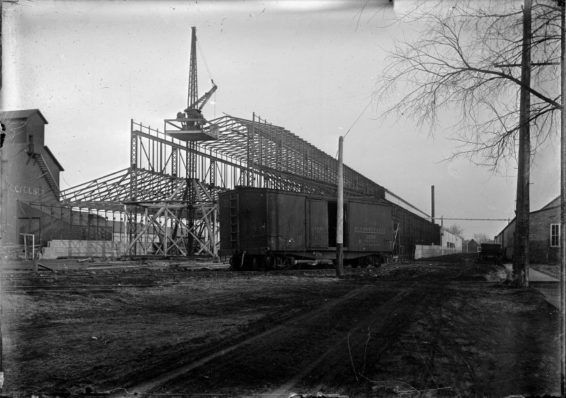 Circa 1910 construction at the Hart-Parr Tractor plant in Charles City, Iowa the home of the first farm tractor. The plant was serviced by two railroads, the Illinois Central and the Chicago, Milwaukee & St. Paul. Taken from a recently discovered collection of glass negatives. View full size.

