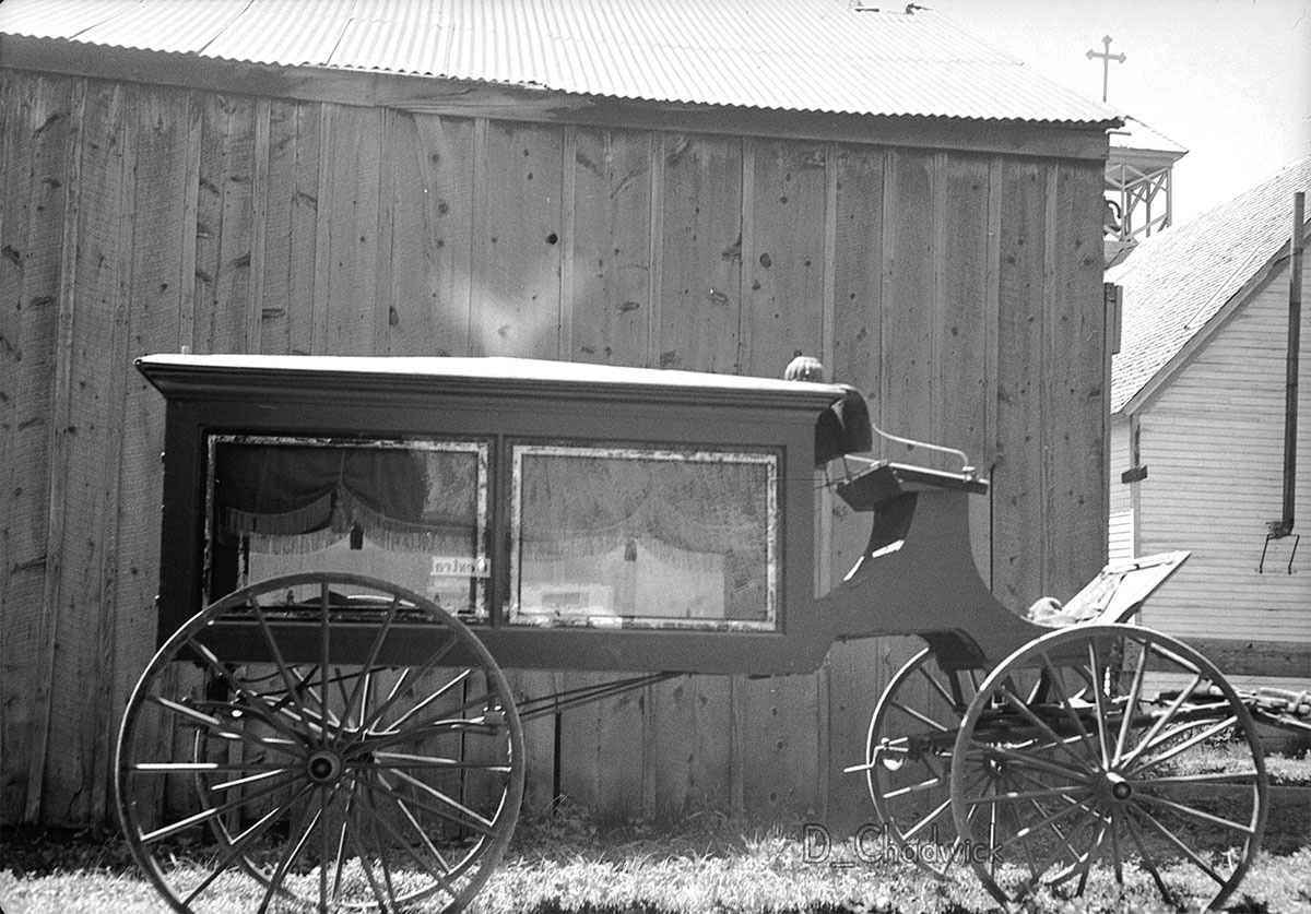 What is that creepy light coming from the roof of the hearse?!?  Scanned from the original negative. View full size.
