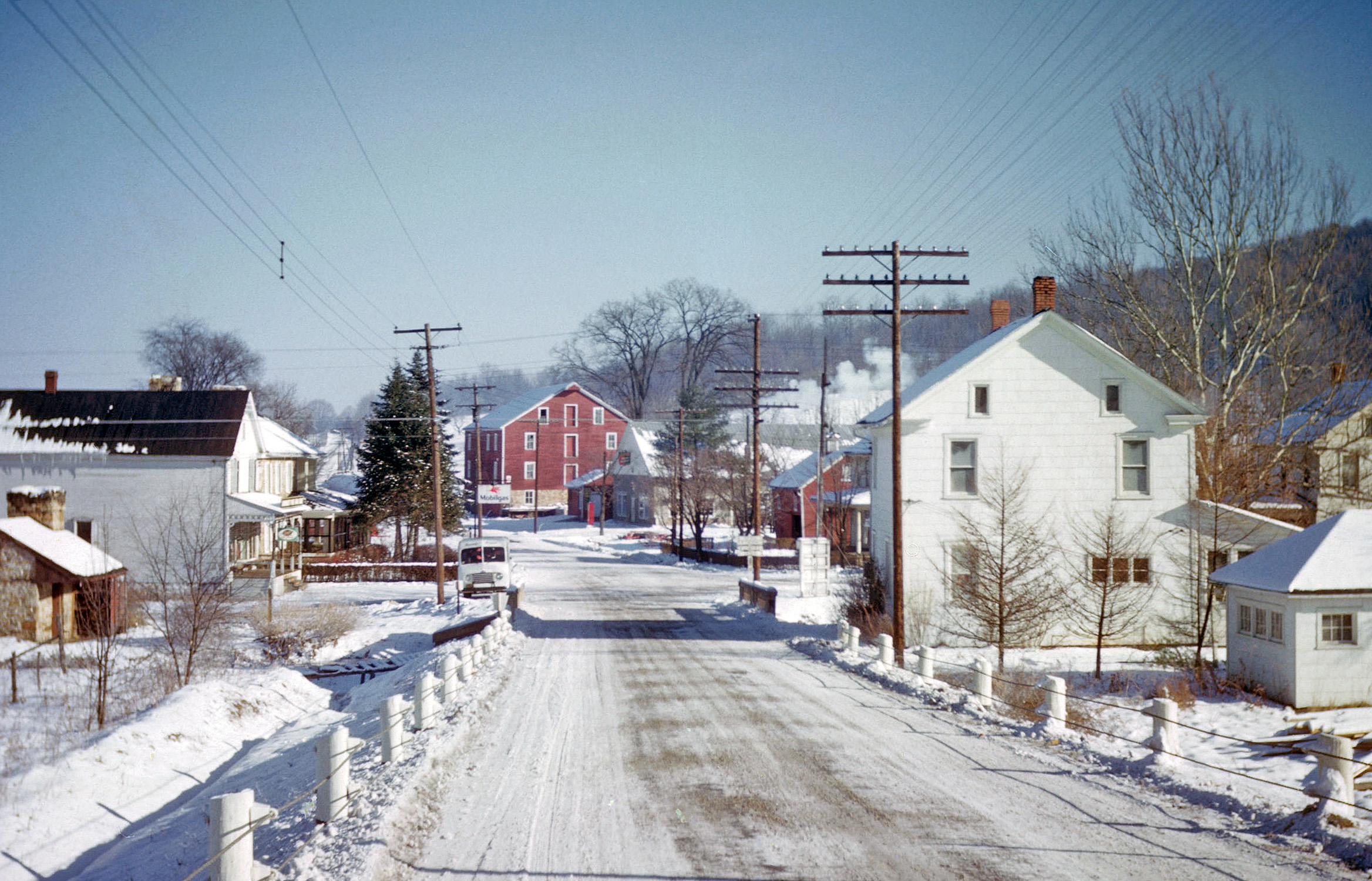 "Downtown" Honey Grove, Pennsylvania shivers on a snowy day, pre-1952. My grandfather's grocery was apparently getting a delivery. View full size.