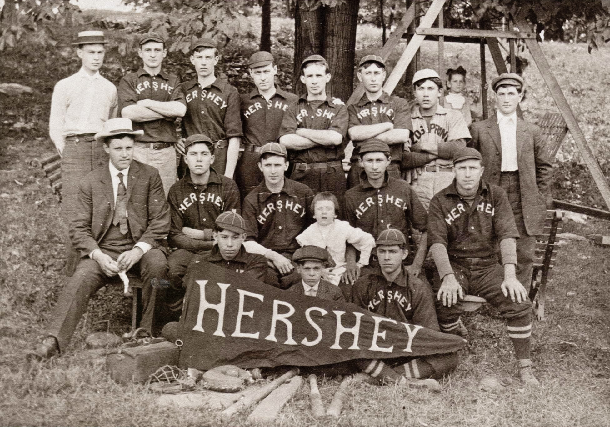 The Hershey Chocolate Company baseball team in the early 1900s. From the Klein Chocolate Company (no longer exists) archives, courtesy of William Klein III, whose grandfather, William Klein, founded the eponymous company and who is standing, last row, left, in the white shirt. He worked for Milton Hershey very early in the history of that chocolate company, then started his own enterprise with his brother in Elizabethtown, Pennsylvania, before World War One. In its heyday Klein was the world's fifth largest chocolate company. Some 85 years after this photo and after my own career with Hershey, Bill Klein III was Best Man at my wedding. Small world. View full size.
