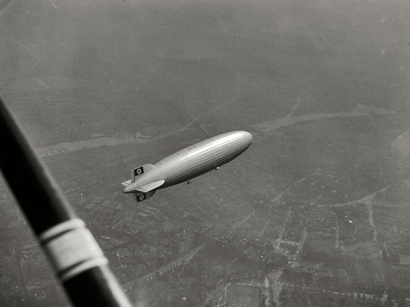 "The Hindenburg over Boston Common, 1936." Sunday marked the 75th anniversary of the German airship's explosion at Lakehurst, New Jersey. Medium format acetate negative by Leslie Jones. Boston Public Library. View full size.