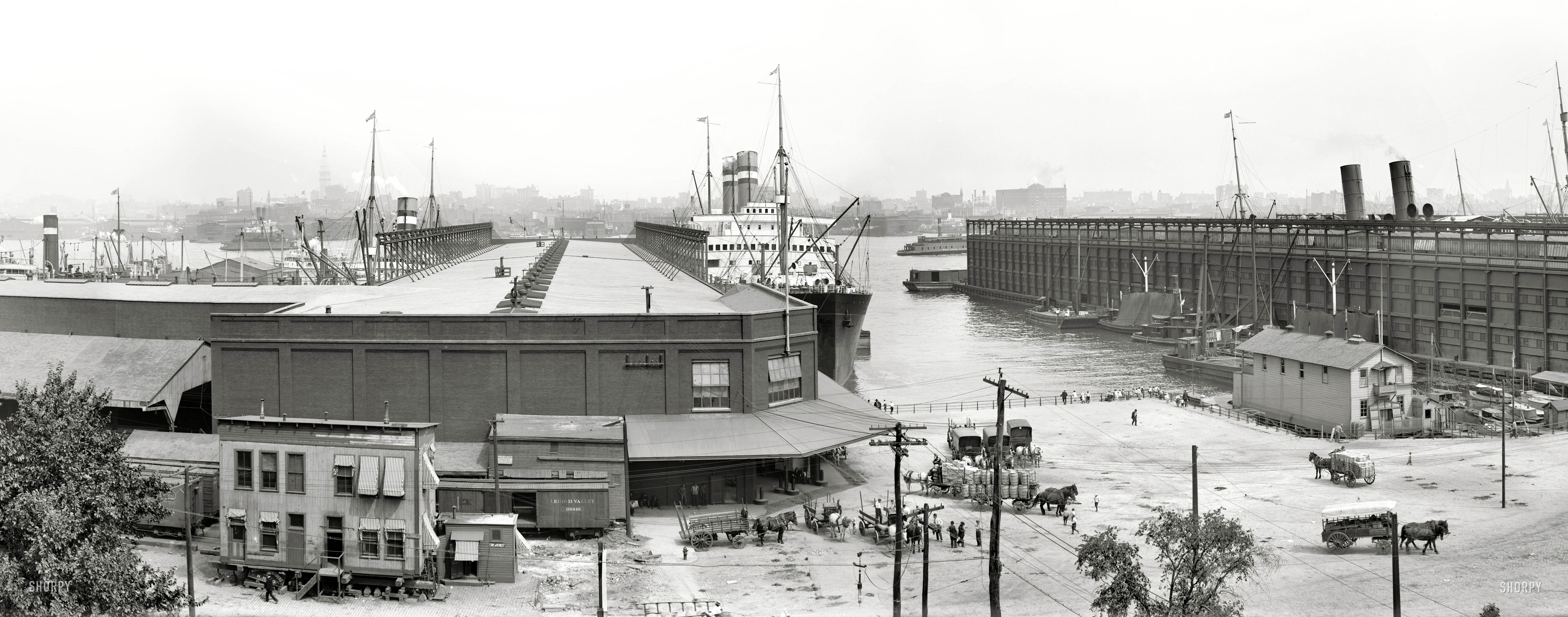 Hoboken, New Jersey, circa 1910. "Holland America docks and Manhattan skyline." Another three-plate panorama showing the S.S. Rotterdam, and a different perspective on the Curious Tipsy Shed. View full size.