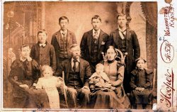 A very large family poses for a portrait by the Hooper Studio in Washington Kansas. If all those people are that woman's children she must have been pregnant for 20 years straight. View full size.
(ShorpyBlog, Member Gallery)