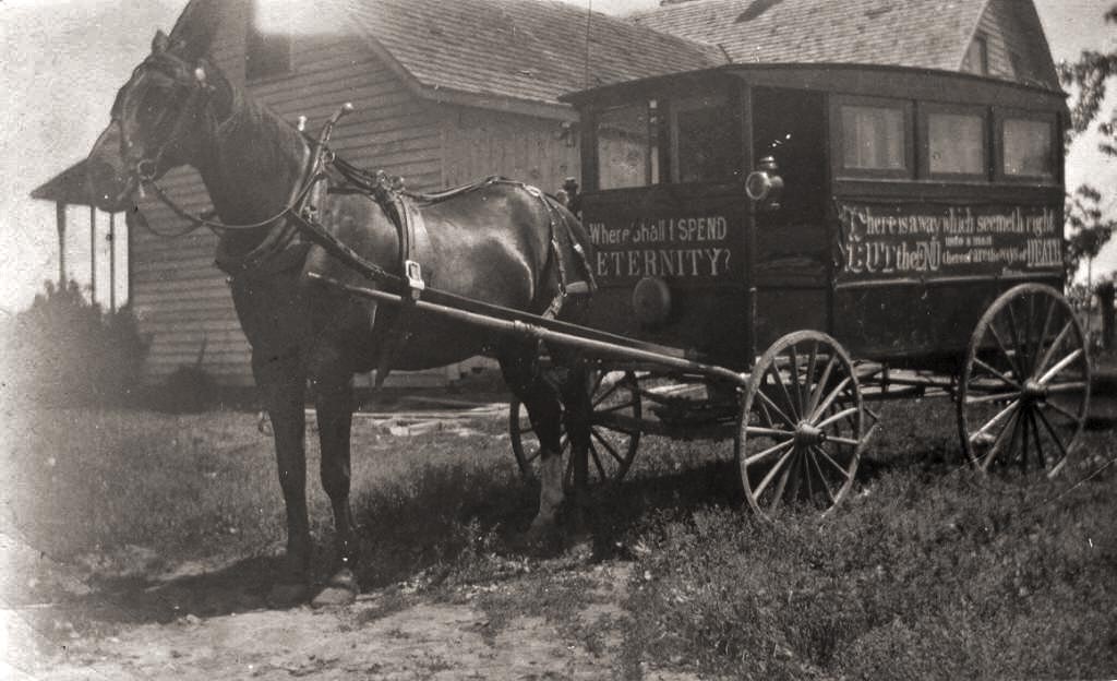 This photo was given to me by my then girlfriend about 15 years ago. She worked at a nursing home and had found it in the effects of a patient who had passed away with no family.

Location and photographer unknown. I'm guessing the wagon belonged to a traveling preacher. From memory I think the print is about 3"x6". If I can find it again, I will try to scan it at a higher resolution.