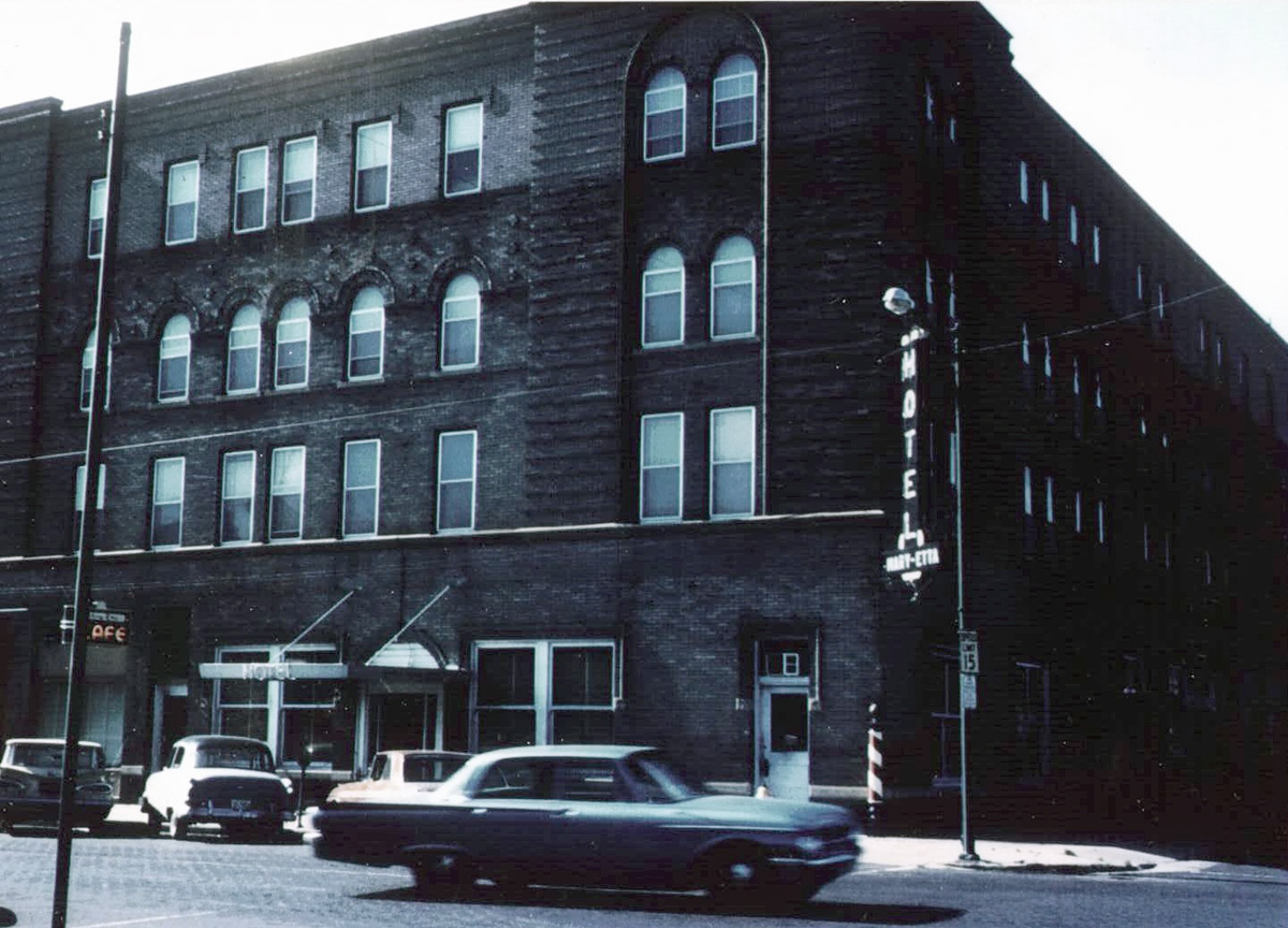 This is the Fairbury, Nebraska hotel where I grew up.  Our apartment was on the top floor in the corner. This picture is from around 1964, about the time my dad started running the place. We ran the cafe, too. View full size.