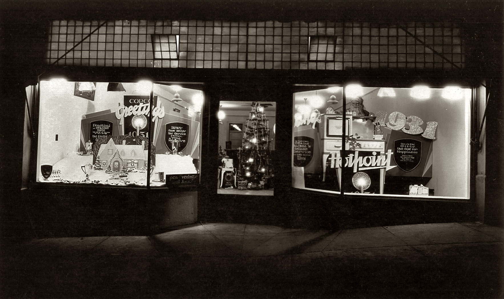 An appliance store at night. Christmas 1931. View full size.