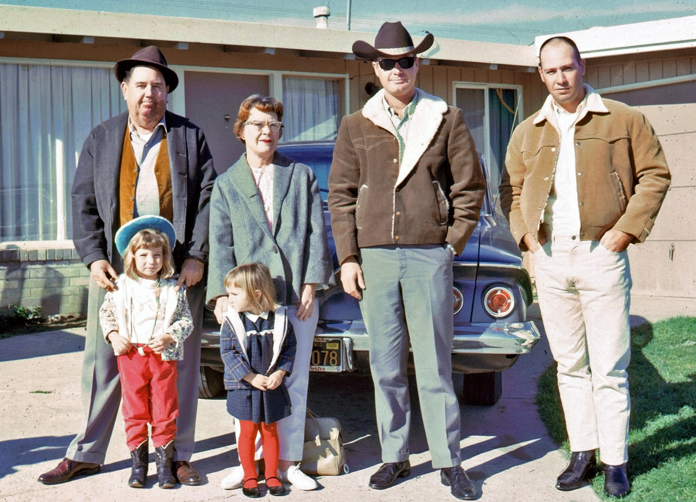 This may or may not be the family who took the pictures of Bakersfield and points north in the big box of slide recently found at a thrift store. They are standing in front of what I think is a 61 or 62 Chevy, the gent on the left looks German to me (there are a bunch of slides from Germany in this lot) then there's the cowboy and on the far right is Buster from the show Arrested Development, or at least he looks like him. View full size.