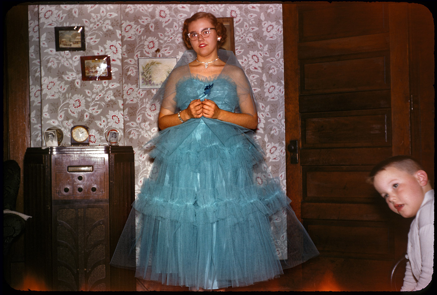 Big sister, a vision in turquoise tulle. Somewhere in the United States circa 1952. Found 35mm Kodachrome transparency, Set 2. View full size.