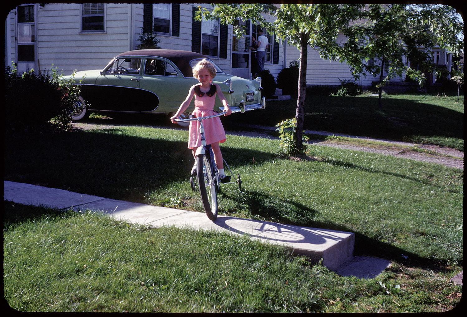 Circa 1952, possibly in Indiana. Another image from Set 2 of found 35mm Kodachromes. Note the Cadillac-inspired tacked-on tailfins on the Ford, which we'll tentatively identify as a 1950 Crestliner. View full size.