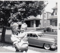 On Hartel Avenue in Philadelphia, 1955. View full size
Car ID1953 Chrysler New Yorker, right? Looks like a hardtop with the windows up. Can't be earlier, since it's a one-piece windshield.
(ShorpyBlog, Member Gallery)