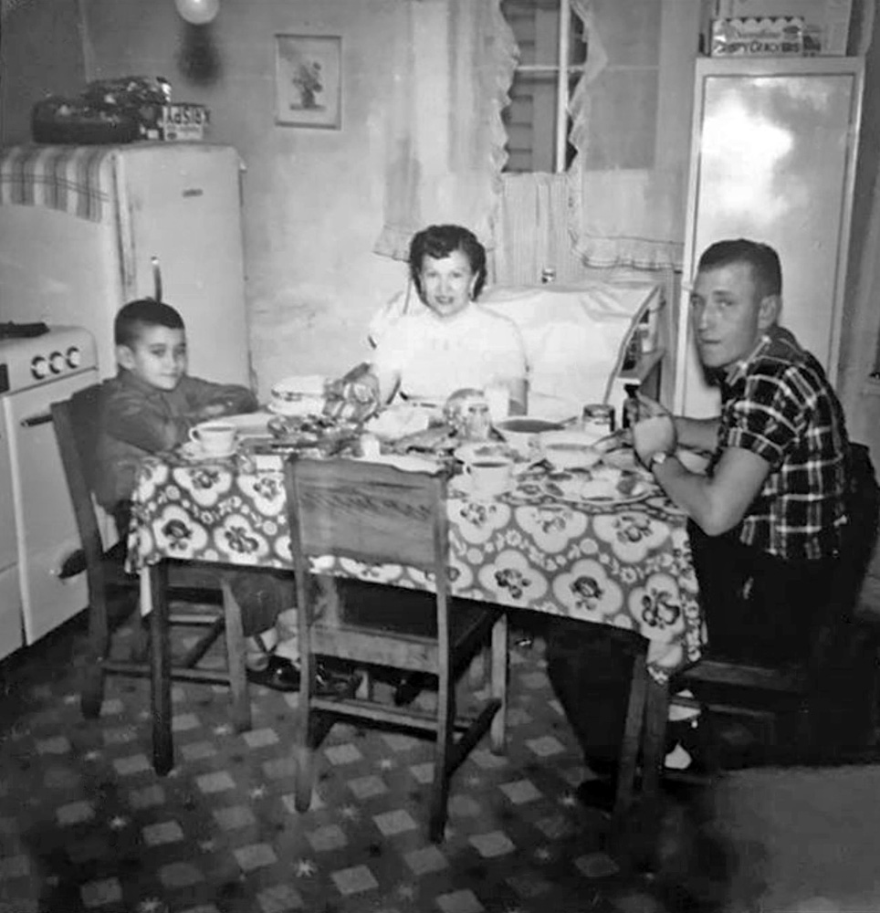 January, 1959, Owensboro, Kentucky. My mother switched seats with me so that my brother could get all of us in the picture. She had prepared fried chicken, mashed potatoes, corn, biscuits, and of course cake.