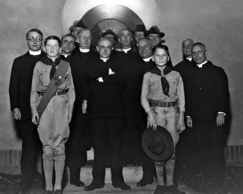 Toledo, OH, 1930s. This negative is a true puzzle.  Neither of the Scouts are related to me, nor are any of this multitude of priests.  One possability was that Granddad was taking this picture as a favor to one of the group from Blessed Sacrament Parish - or one of the boys was a neighbor - or one of the boys was someone that my aunt had a schoolgirl crush on.
I found an original print in my aunt's scrapbook from the early 1930's - and the back of the photo has no names or notes (Drat!).
View full size.
