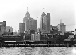 Downtown Detroit as seen from the Detroit River.  The tall building flying the American flag is the Guardian building (built 1928-29).  The Guardian building still stands and is the headquarters for Wayne County, Michigan. View full size.
(ShorpyBlog, Member Gallery)
