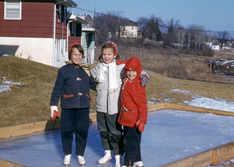 Three girls on a backyard skating rink in suburban Minneapolis, Minnesota, during the 1960s. From a 35mm Kodachrome purchased on eBay. View full size.
